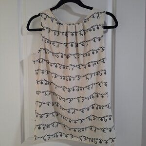 Black and white lucky charm bracelet pattern sleeveless blouse with buttons us 6